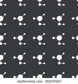White image of molecule repeated on black background