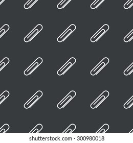 White image of paperclip repeated on black background