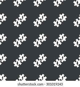 White image of puzzle pieces with man and woman repeated on black background