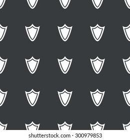 White image of shield repeated on black background