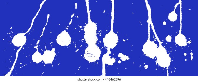 White ink splash, stains, strokes and blots on blue. Paint Splatter Background.