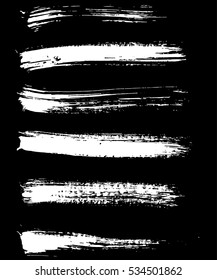 White ink vector brush strokes isolated on black background. Vector illustration. Grunge texture