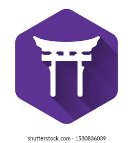 White Japan Gate icon isolated with long shadow. Torii gate sign. Japanese traditional classic gate symbol. Purple hexagon button. Vector Illustration