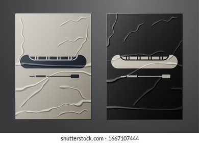 White Kayak and paddle icon isolated on crumpled paper background. Kayak and canoe for fishing and tourism. Outdoor activities. Paper art style. Vector Illustration