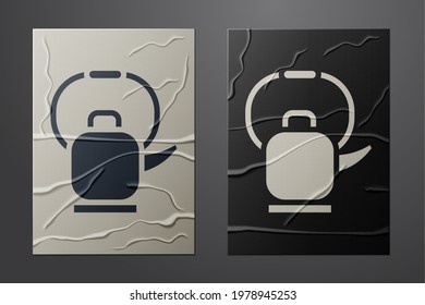 White Kettle with handle icon isolated on crumpled paper background. Teapot icon. Paper art style. Vector Illustration