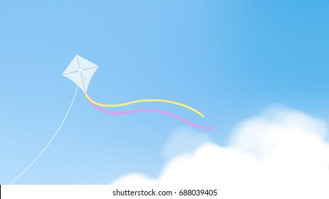 White kite with tails flying over bright clear blue sky