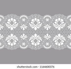 white lace border with floral pattern on a gray background