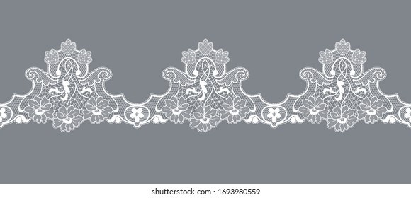 white lace border with floral pattern on a gray background