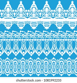 White lace braid on a blue background.