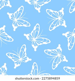 White lace butterflies on blue background. Vector seamless pattern. Best for textile, print, wallpapers, and wedding decoration.