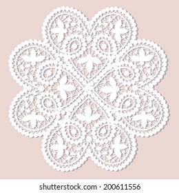 White lace doily with flowery pattern on a beige background