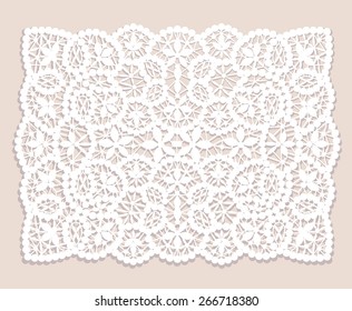 White Lace Doily With Flowery Pattern On A Beige Background