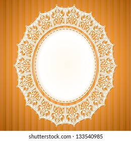 White lace doily on an orange background