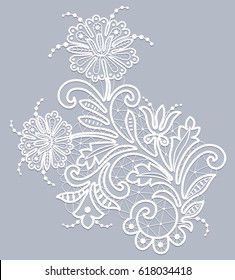 White lace floral element on gray background