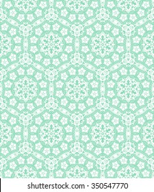 White lace with floral pattern on a green background
