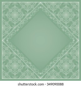 White lace frame on light green. Ornate element for design and place for text. Ornamental lace pattern for wedding invitations and greeting cards. Traditional floral decor.