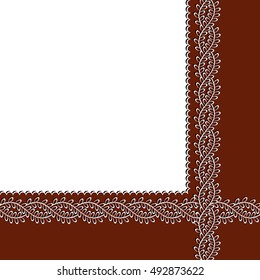 white lace frame with shadow on a brown background