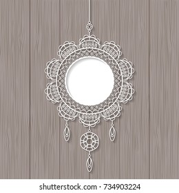White lace pendant on wooden background. Decorative design element, lacy holiday decoration for Christmas and New Year. Vector illustration