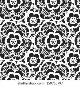 White lace seamless pattern with flowers on black background