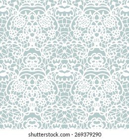 White lace seamless pattern with flowers on blue background