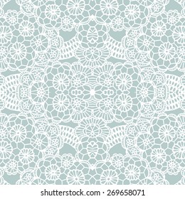 White lace seamless pattern with flowers on blue background