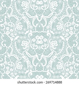 White lace seamless pattern with flowers on blue background