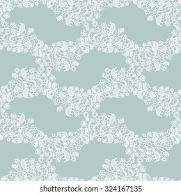 White lace seamless pattern with flowers on blue background