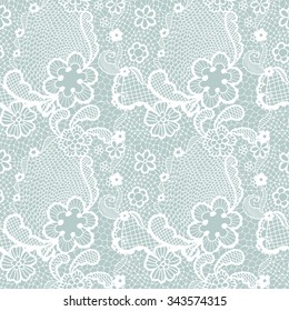 White lace seamless pattern with flowers on blue background