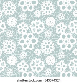 White lace seamless pattern with flowers on blue background