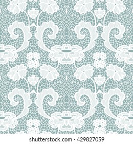 White lace seamless pattern with flowers on blue background