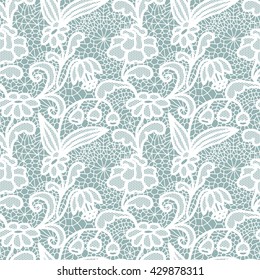 White lace seamless pattern with flowers on blue background