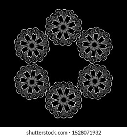 White lace snowflakes on a black background. Floral snowflakes.