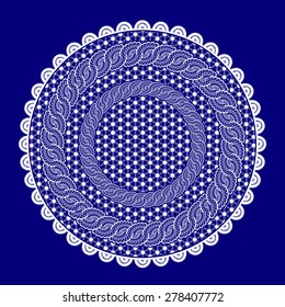 white lace table cloth on a dark blue background