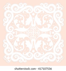 White lacy doily with flowery pattern on a pink background