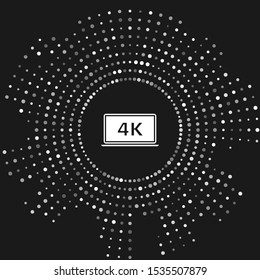 White Laptop screen with 4k video technology icon isolated on grey background. Abstract circle random dots. Vector Illustration