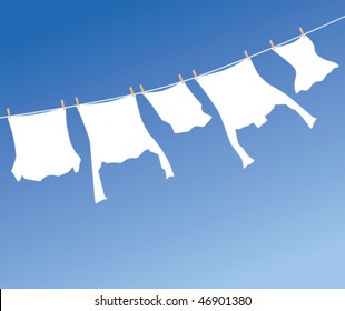 White laundry hanging to dry on a clothes-line.