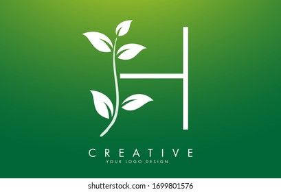 White Leaf Letter H Logo Design with Leaves on a Branch and Green Background. Letter H with nature concept. Eco and Organic Letter Vector Illustration. 