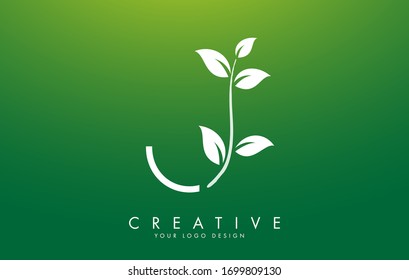 White Leaf Letter J Logo Design with Leaves on a Branch and Green Background. Letter J with nature concept. Eco and Organic Letter Vector Illustration. 