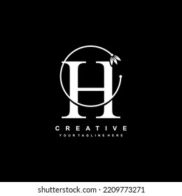 white letter H logo template with floral ornaments and circular lines. elegant and luxurious letter H logo design. beautiful letter H logo vector. H icon