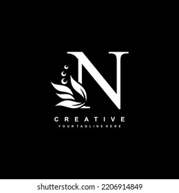 White letter N logo design with flourish ornaments. logo N with floral and leaf ornaments. N beautiful logo. luxury letter N logo design