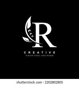 logotipo de letra blanca R con adorno de oro de lujo. R florecer, R monograma, tipografía. logo de plumas. Diseño premium R. adecuado para el logotipo de la empresa, negocios, boutique, boda, celebración, etc