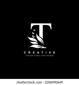 White letter T logo design with flourish ornaments. logo T with floral and leaf ornaments. T beautiful logo. luxury letter T logo design