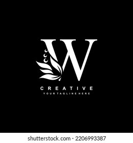 White letter W logo design with flourish ornaments. logo W with floral and leaf ornaments. W beautiful logo. luxury letter W logo design