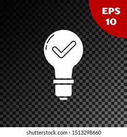 White Light bulb and check mark icon isolated on transparent dark background. Concept of idea.  Vector Illustration