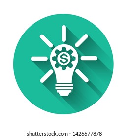 White Light bulb with gear inside and dollar symbol icon isolated with long shadow. Fintech innovation concept. Green circle button. Vector Illustration