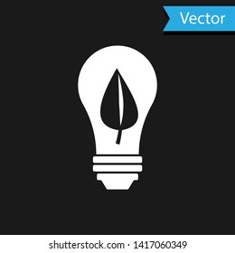 White Light bulb with leaf icon isolated on black background. Eco energy concept. Alternative energy concept. Vector Illustration