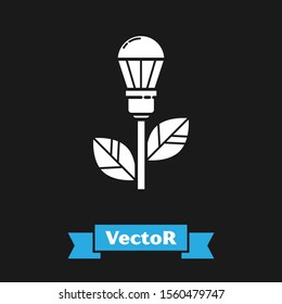 White Light bulb with leaf icon isolated on black background. Eco energy concept. Alternative energy concept.  Vector Illustration