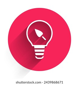 White Light bulb with leaf icon isolated with long shadow. Eco energy concept. Alternative energy concept. Red circle button. Vector