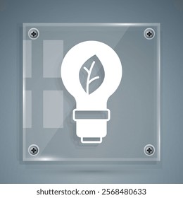 White Light bulb with leaf icon isolated on grey background. Eco energy concept. Alternative energy concept. Square glass panels. Vector