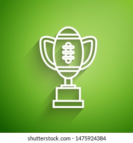 White line Award cup and American football ball icon isolated on green background. Winner trophy symbol. Championship or competition trophy.  Vector Illustration